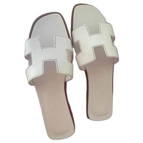 hermes gold hardware loafer white|Hermes slippers for women.